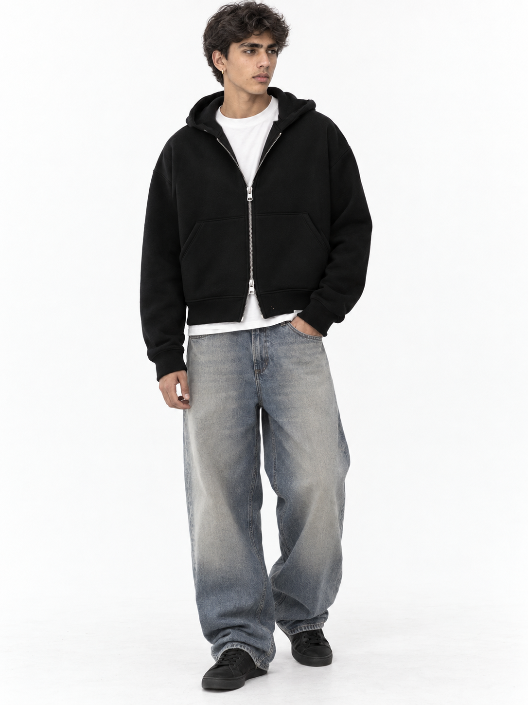 Full-length view of the black Fanaze double zipper hoodie styled with grey baggy jeans.